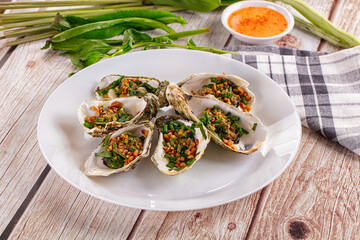 Gournet grilled oysters with onion and peanut