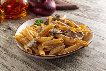Italian pasta penne with chicken liver