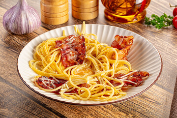 Italian classic spaghetti carbonara with bacon and egg