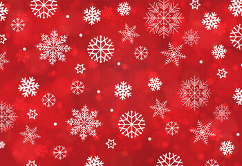 Vibrant red backdrop filled with white snowflakes of various sizes creates a cheerful festive mood for holiday campaigns, winter celebrations, greeting cards, or seasonal marketing materials.
