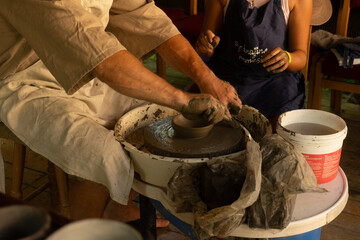 Potter Shaping Clay on a Wheel – Hands Close-Up