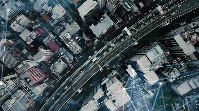 現代都市と道路の真俯瞰ドローン空撮と通信ネットワークのコンセプトイメージ