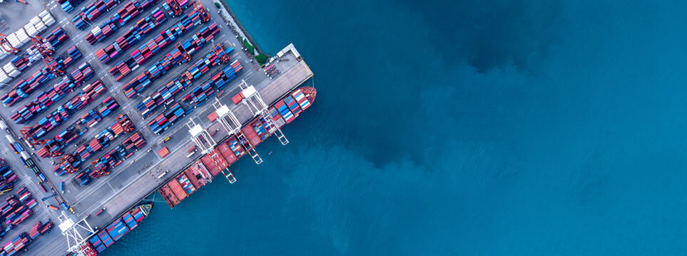 Aerial view of container cargo ship at sea port terminal, Container cargo ship in import export logistic freight shipping, Logistics transportation international by container cargo ship.