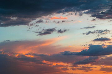 Partly cloudy sky at sunset. Dramatic clouds