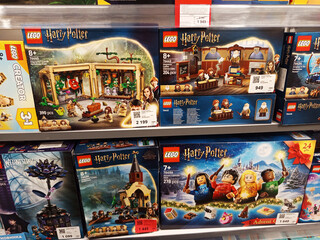 Fototapeta premium Zvyagel, Ukraine - October 15, 2025: LEGO Harry Potter themed building sets displayed on store shelf, showcasing various characters and scenes from the popular wizarding world franchise