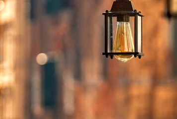 Decorative lamp in the street cafe. Rome          
