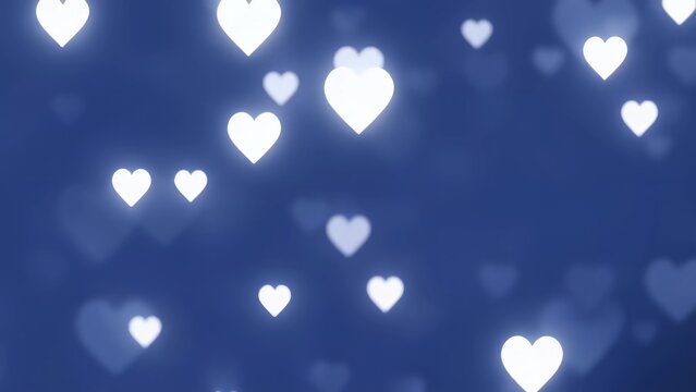 Bokeh (blur) effect of a glowing white heart floating on a navy blue background - Powered by Adobe