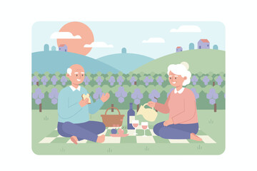Happy senior couple enjoying a relaxing outdoor picnic with food and drink