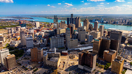 Downtown Detroit skyline and Detroit River. Drone aerial photo of downtown Detroit, Michigan with skyscrapers and the Detroit River on a sunny day. © Vadim