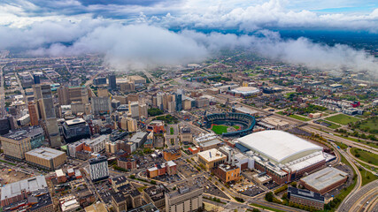 Detroit skyline with Comerica Park from above the clouds. Drone aerial image of downtown Detroit skyline and Comerica Park stadium partially covered by clouds. © Vadim