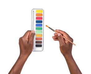 Man holding a paint palette and an art brush in hands and painting isolated on white or transparent...