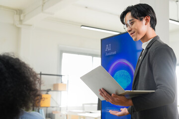 Diverse business professionals, both male and female, collaborate in a bright modern office, using an AI-powered virtual assistant to brainstorm innovative ideas, analyze big data insights