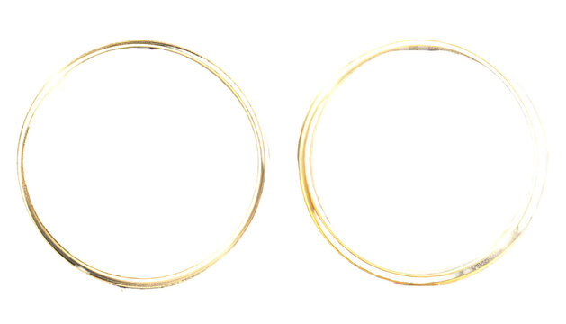 Two blurry, glowing golden circles isolated against a black background