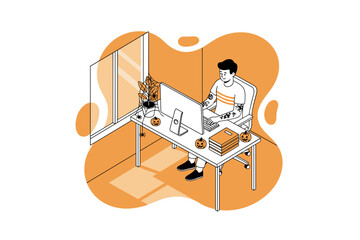 Man working on computer at Halloween decorated desk remote work concept