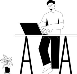 A boy working with a laptop, standing desk