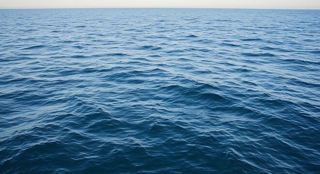 Vast ocean surface with blue water and horizon line on a bright day - Powered by Adobe