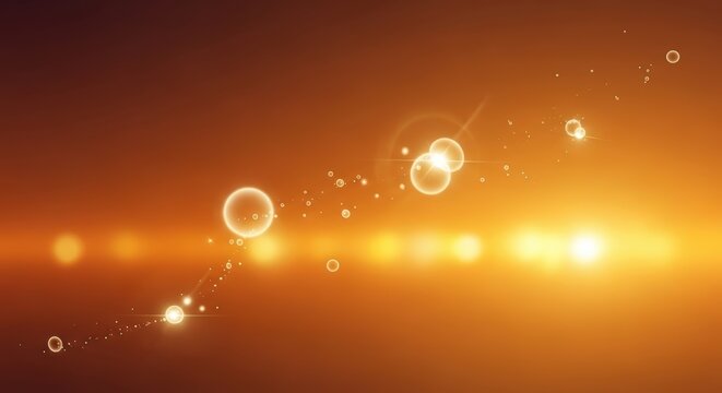 Abstract glowing particles and bokeh effects against a warm orange gradient background.