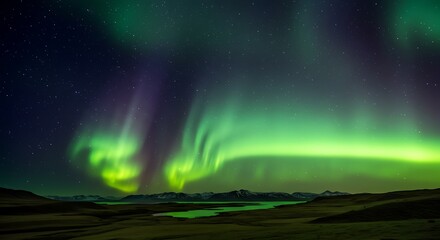 Naklejka premium Vibrant aurora borealis displaying green and purple hues across the night sky