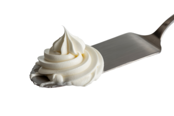 A swirl of creamy white frosting on a metal spatula, isolated on a transparent background. background removed