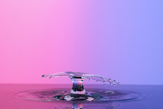 Water splash like umbrella on color background - Powered by Adobe