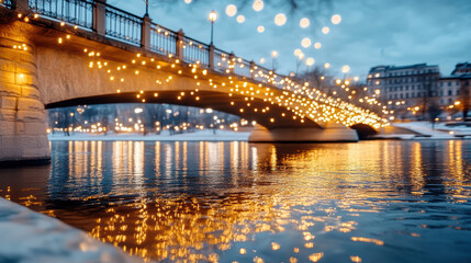 Fototapeta premium Golden lights illuminate bridge at night, reflecting beautifully on water surface