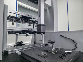 Advanced 3D automated testing machine with precision instruments in a laboratory setting