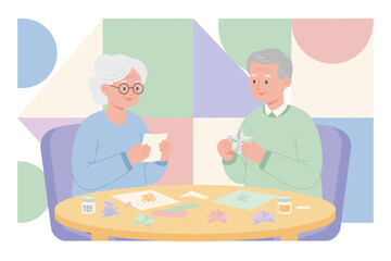 Retired couple crafting paper stars enjoying a creative peaceful hobby