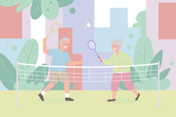 Elderly couple happily playing badminton outdoors Active seniors enjoying recreational sports