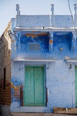 Wooden Door in an Old Blue Building in Jodhpur