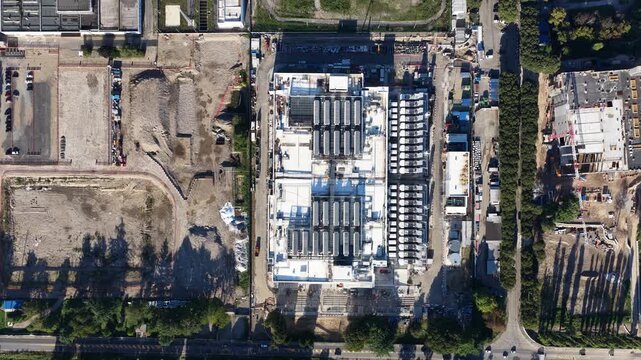 New constructed data center in Milan Italy. Big data, high tech, server space and AI, artificial intelligience in Italy. Aerial video. Hyperscaler. Machine learning and IT technology.