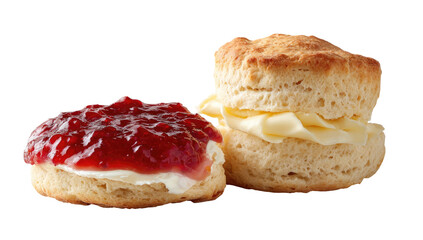 Two English scones, one with jam, the other with butter. Isolated on black background