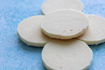 Close-Up of Ginger and Lemon Cookies on a Pink Plate with a Blue Background
