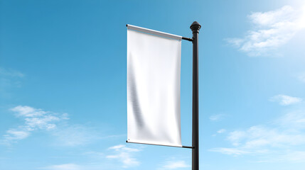 White blank banner mockup on pole against blue sky