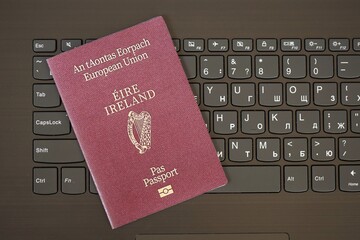 Ireland Passport Lies Black Laptop