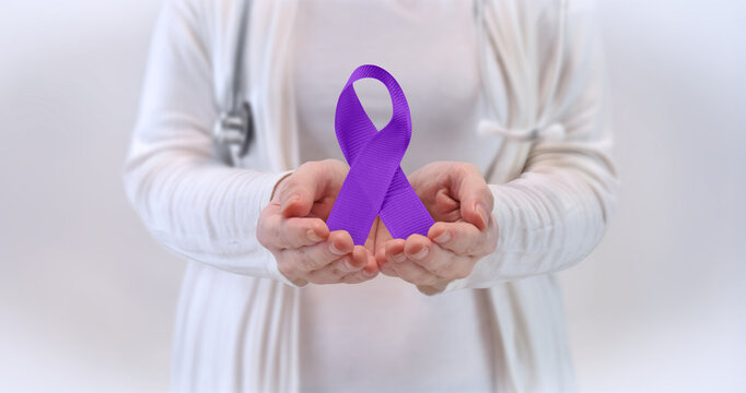 Awareness Ribbon Concept - Doctor Holding Purple Awareness Ribbon - Alzheimer's, Domestic Violence Prevention, Pancreatic Cancer, Epilepsy