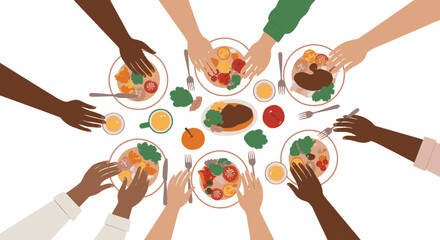 Overhead view of a group of people eating together at a table.