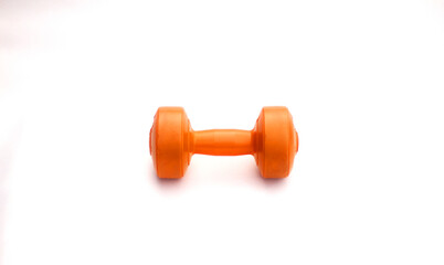 Fototapeta premium Orange dumbbells on a white background