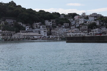 Fishing Village's Boats and the Sea's Voice. Though I see no fish's shadow, I imagine it and sing.