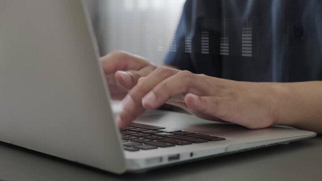 Person typing on laptop with data graph overlay, analyzing business data and technology analytics in modern digital workspace while working remotely using keyboard and hands - Powered by Adobe