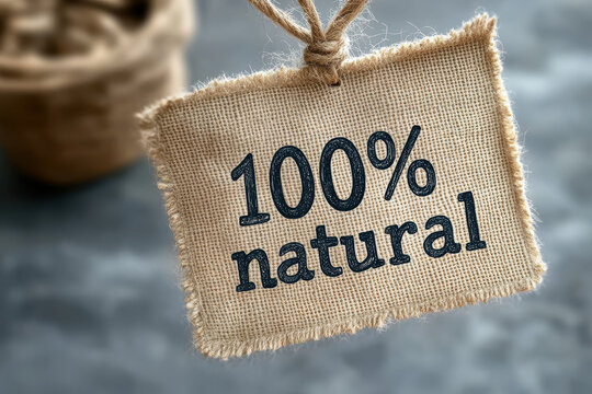 Authentic 100% natural product label on rustic burlap, perfect for organic branding and eco friendly marketing