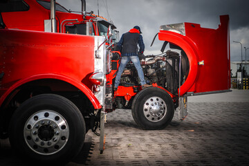 Obraz na płótnie Canvas Truck Maintenance at Busy Hub in Overcast Weather Obraz na płótnie Canvas Truck Maintenance at Busy Hub in Overcast Weather