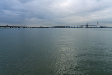 Fototapeta premium idyllic seascape with a long highway bridge