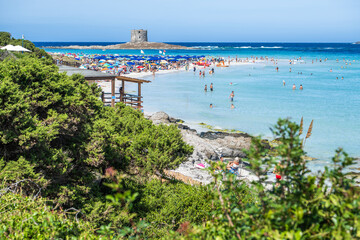 People Enjoy Sun and Sea at a Beautiful Beach Sardinia Island in the Mediterranean Sea