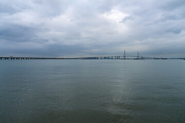 Fototapeta premium idyllic seascape with a long highway bridge