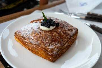 blueberry pie on a white ceramic dish