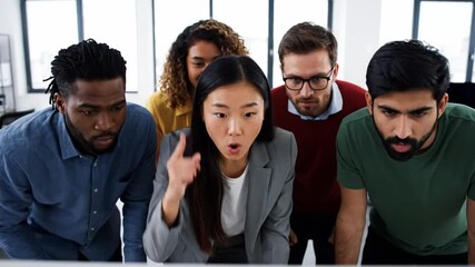 Business team celebrating a success in front of a computer - Powered by Adobe