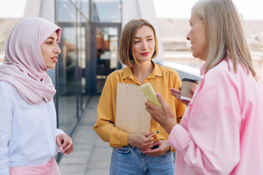 Diverse businesswomen colleagues having conversation during coffee break - Powered by Adobe