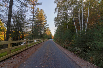 Brilliant fall foliage along the Adirondack Rail Trail near Floodwood in the Adirondacks upstate NY