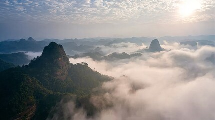 Majestic Mountain Peaks Emerging from a Sea of Clouds at Sunrise