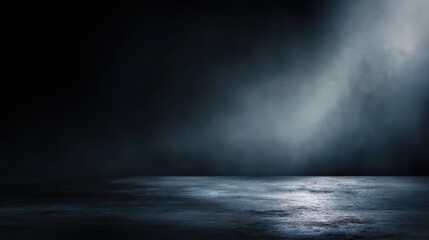 Dark, atmospheric scene with textured wet floor and misty blue-grey lighting. Empty stage or abstract background with dramatic mood, blurred black background